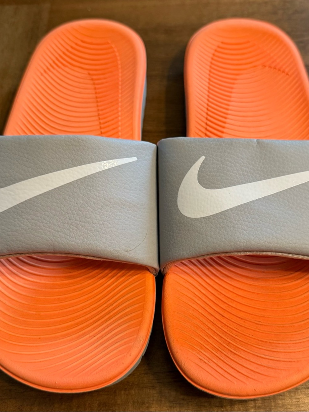 Nike Gray and Orange slide with White swoosh and Orange Footbed